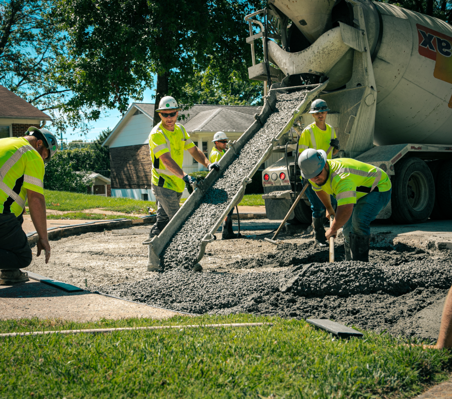 Above & Below Contracting Employee Pouring Concrete