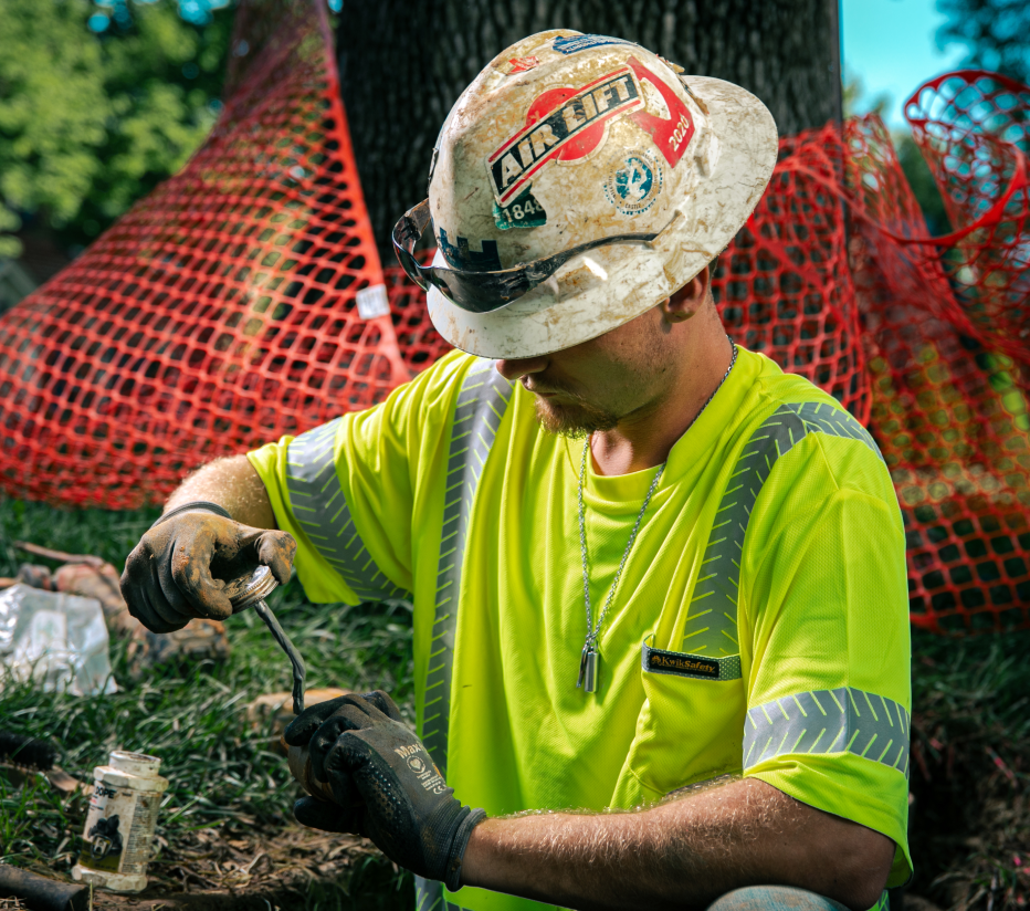 Above & Below Contracting Employee Working