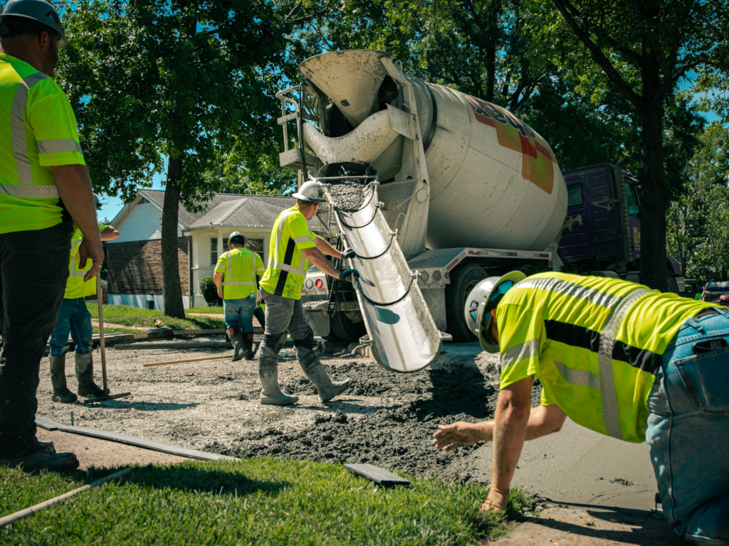 Above & Below Contracting - Workers Spreading Concrete